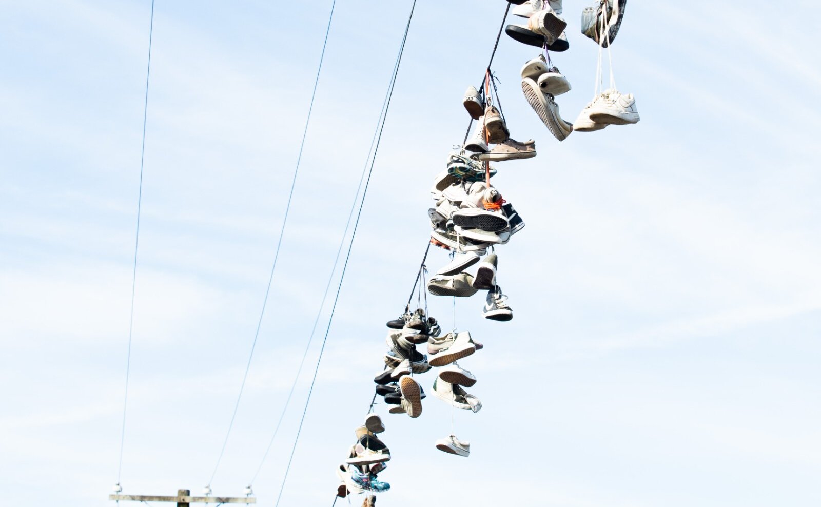 Row of shoes on the powerline
