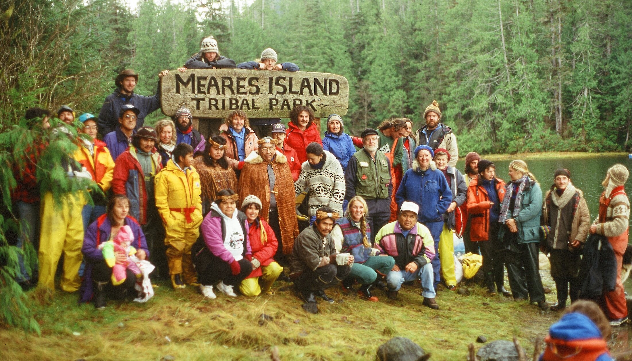Group of activists standing together against a Meares Island Tribal Park sign