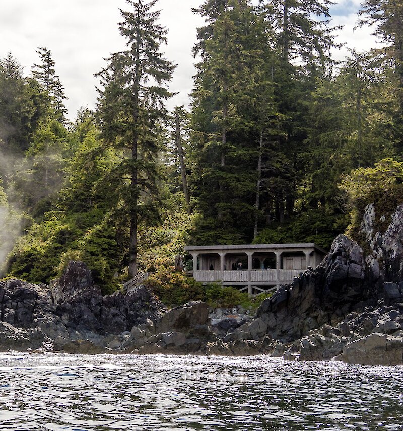 View in the distance of Hot Springs Cove and the viewing deck and changerooms.