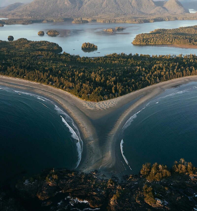 Aerial photo of the tombolo that divides Chesterman Beaches (North from South) and extends out to Frank Island in the middle. Clayoquot Sound is visible in the background.