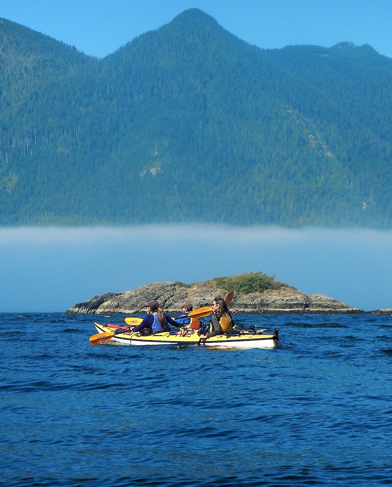 Kayaking on the ocean with islands in the background