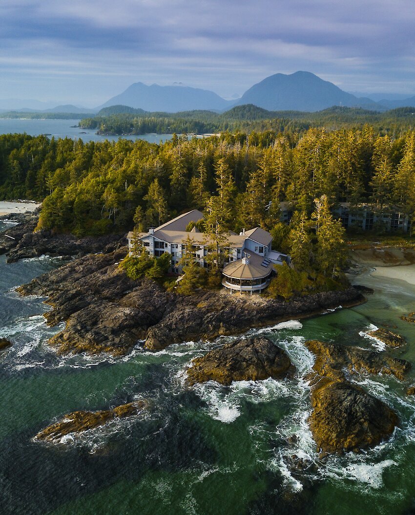 Aerial view of Wickaninnish Inn with ocean, tidal rocks and beach