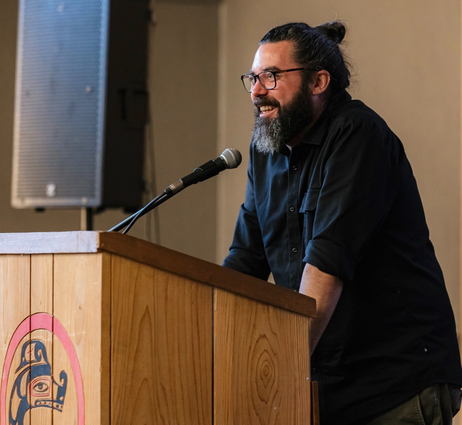 Brad Parsell, Executive Director of Tourism Tofino, speaking at a podium