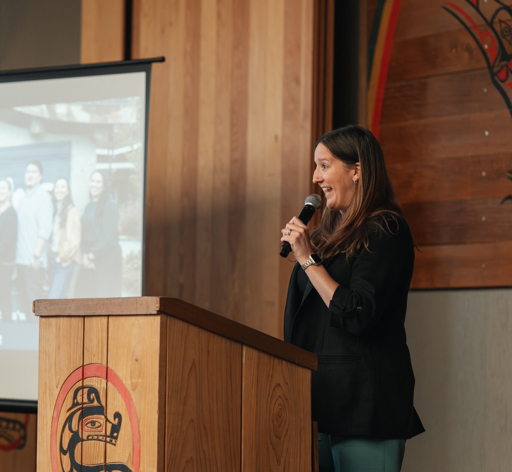 Samantha Hackett, Executive Director of Tourism Tofino, speaking at a podium