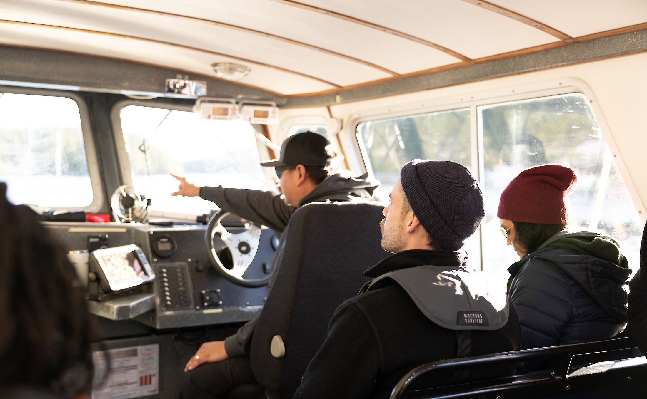 Inside of a whale watching boat with people going on a tour