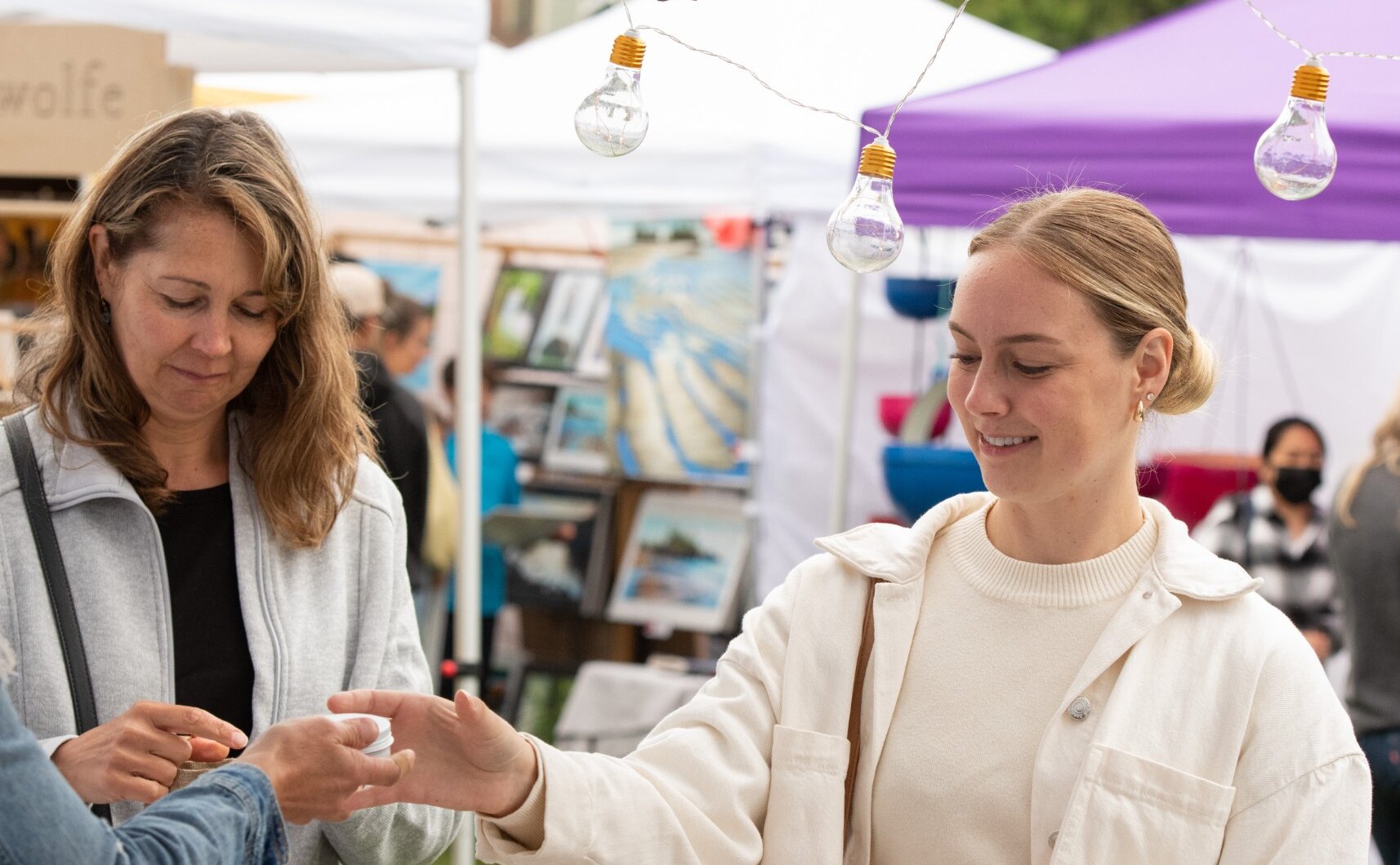 Two people shopping at the local outdoor market