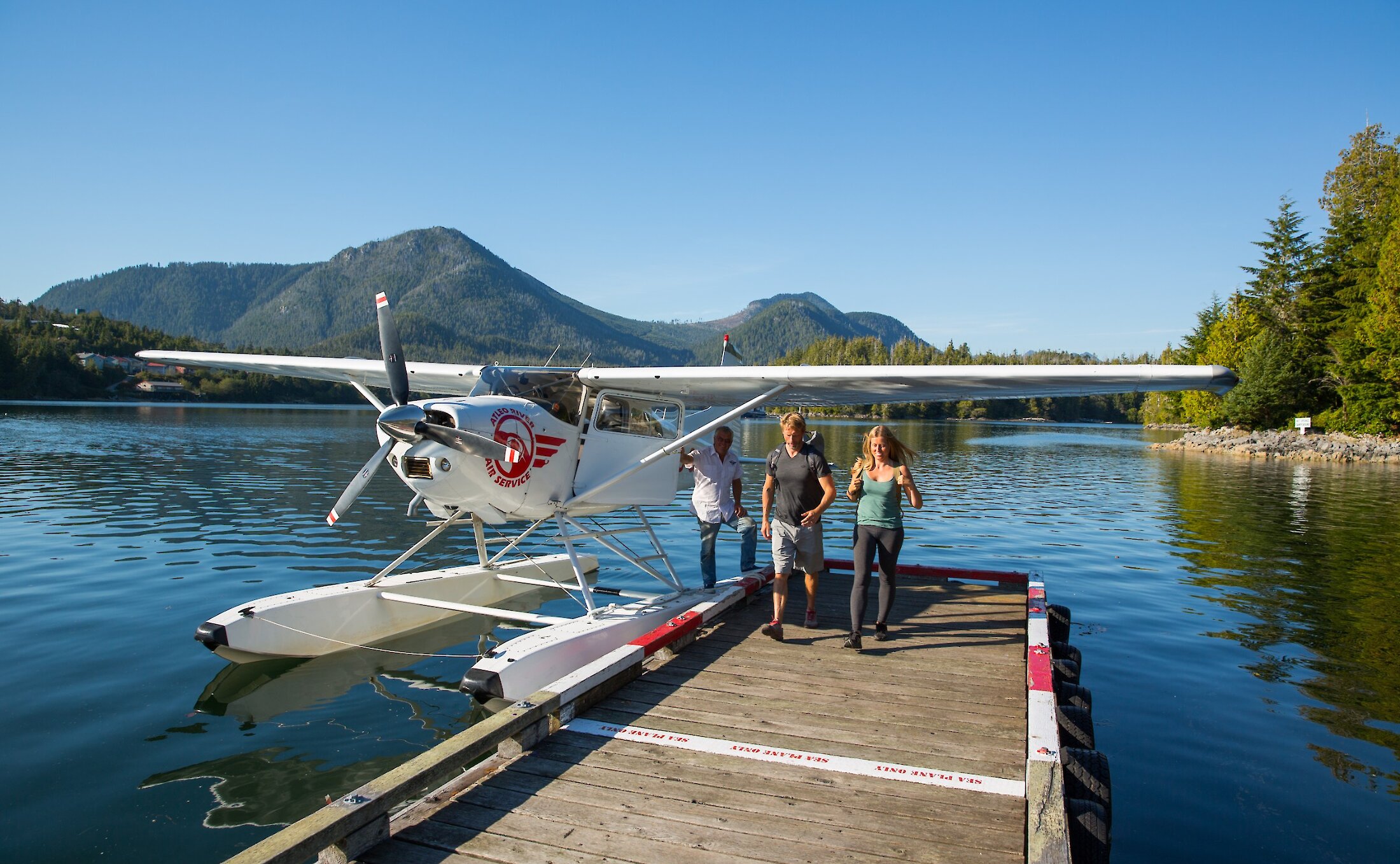 Walking the dock next to a float plane at Hot Springs Cove.