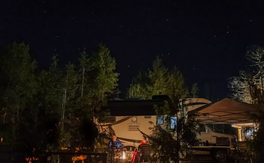 Night view of an RV at the Tsawaak RV Resort and Campground.