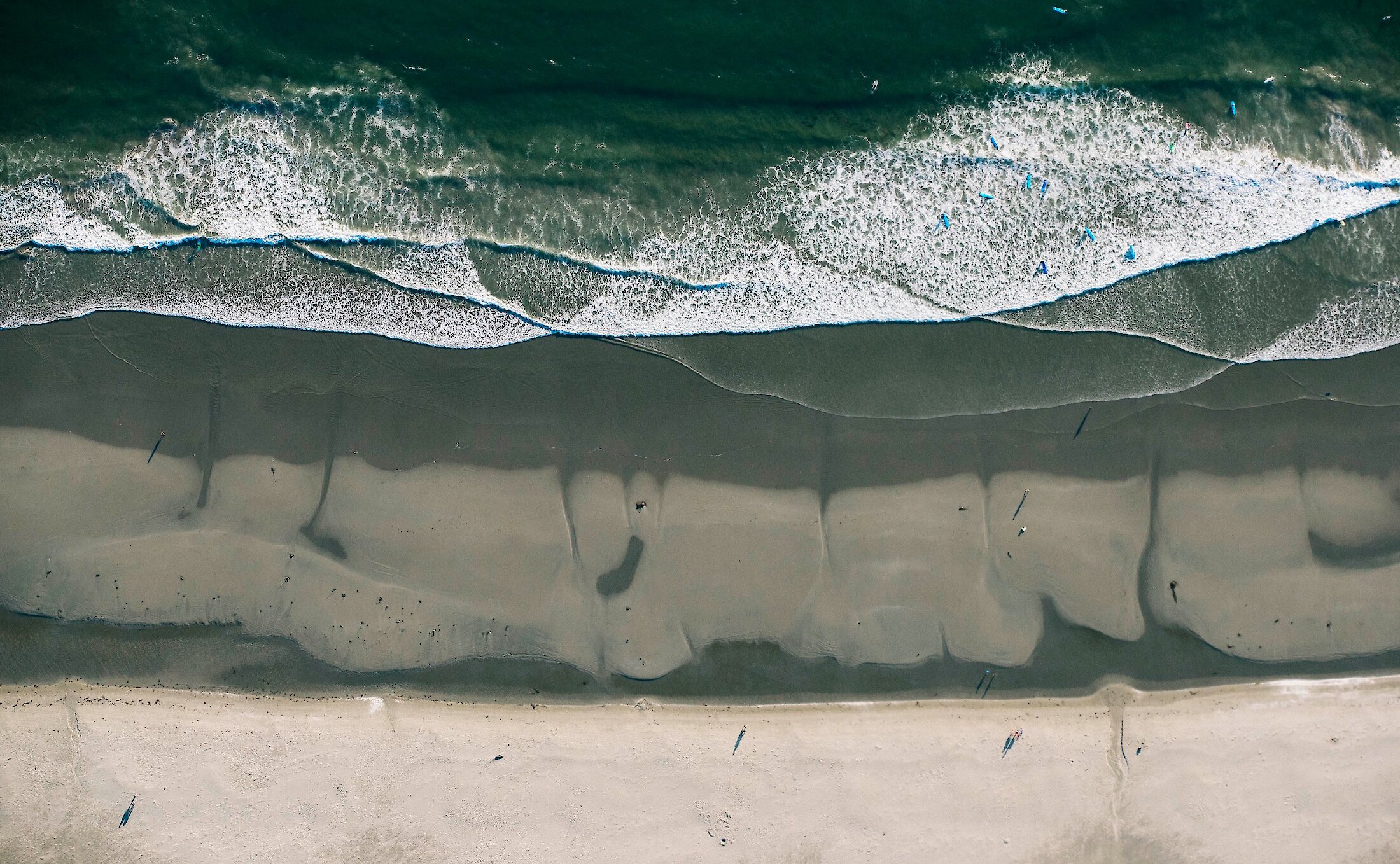 Surf, sand and beach from above