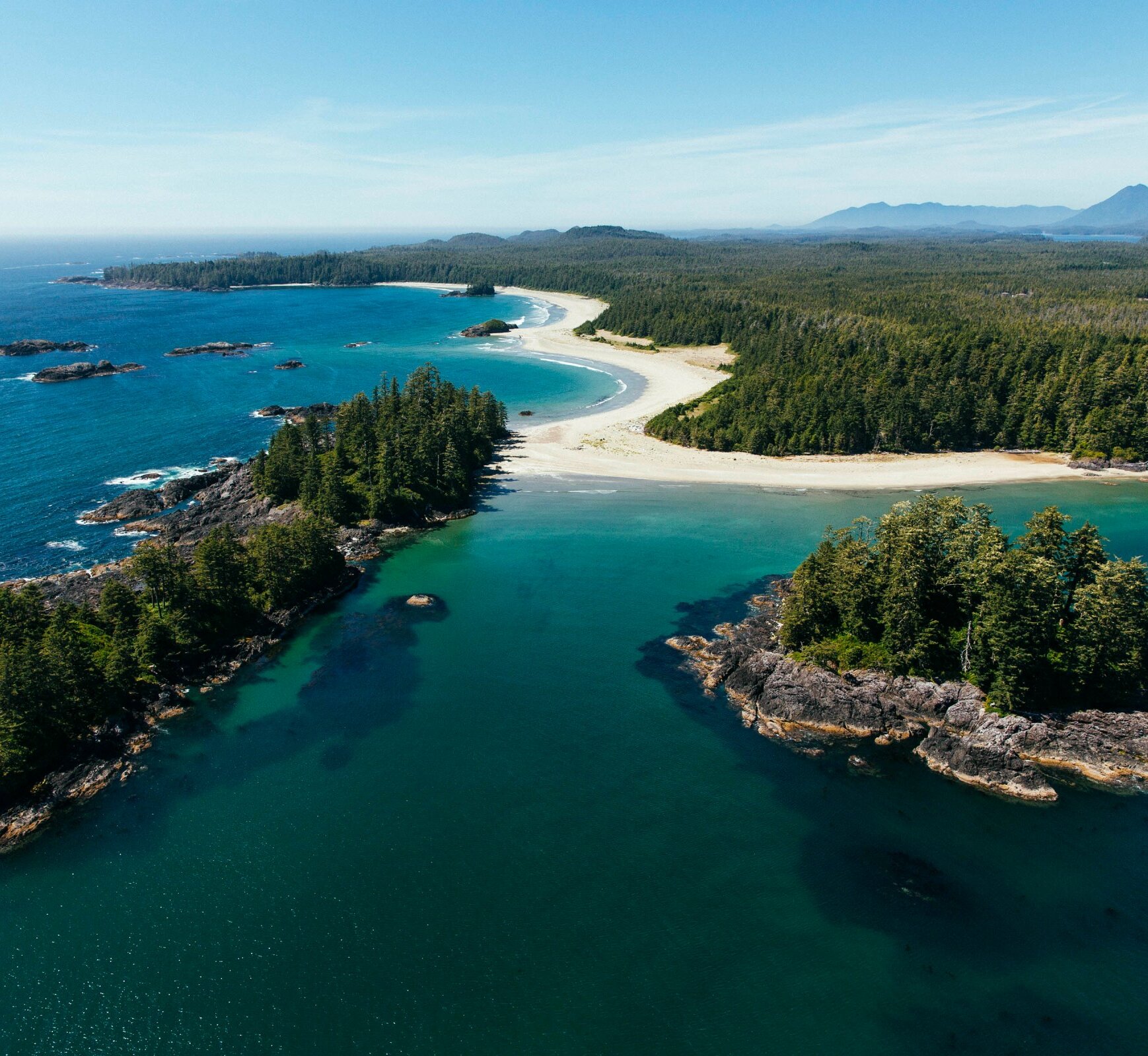 Two islands set with beach and mainland in the background