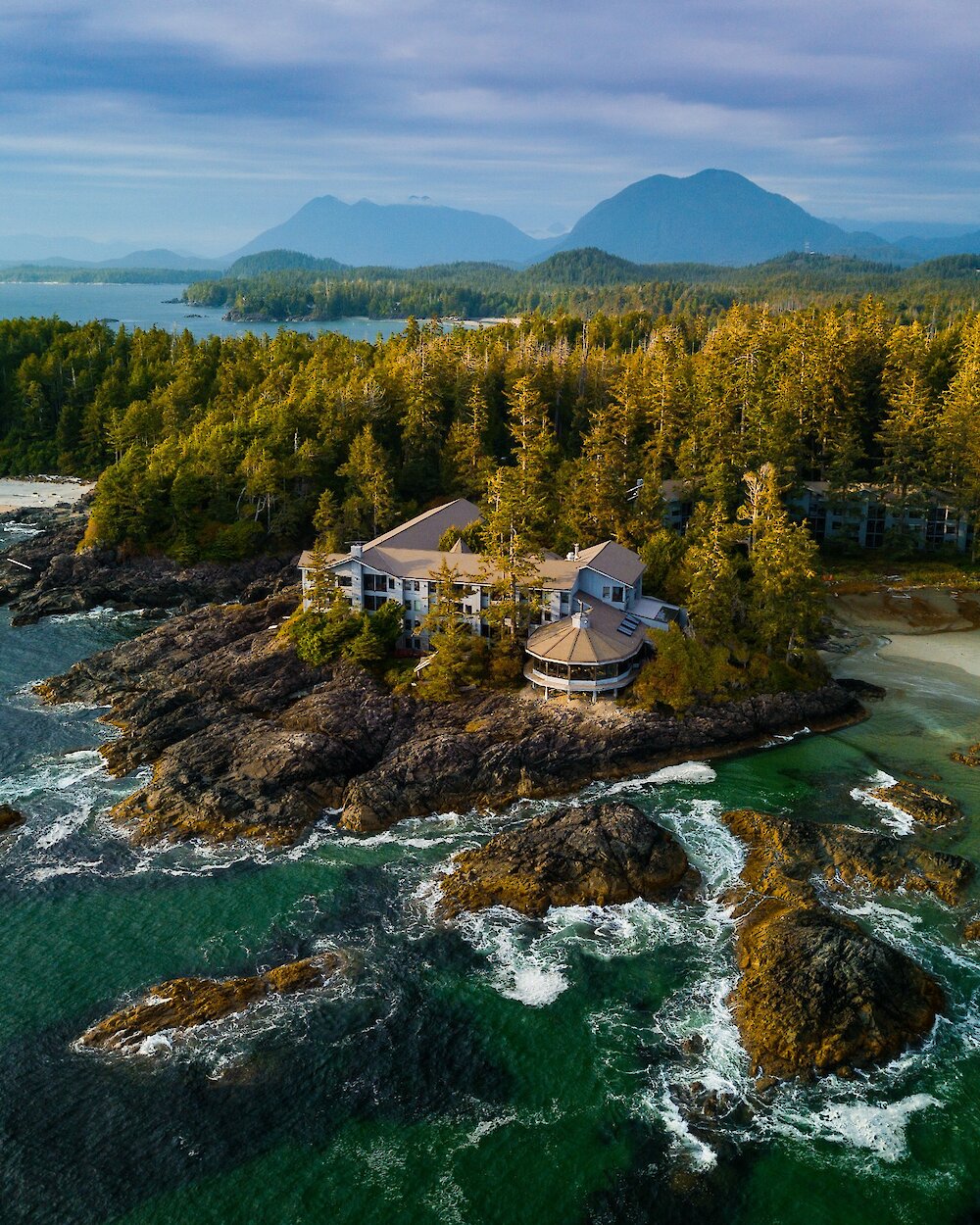 Aerial view of Wickaninnish Inn with Clayoquot Sound in the background.