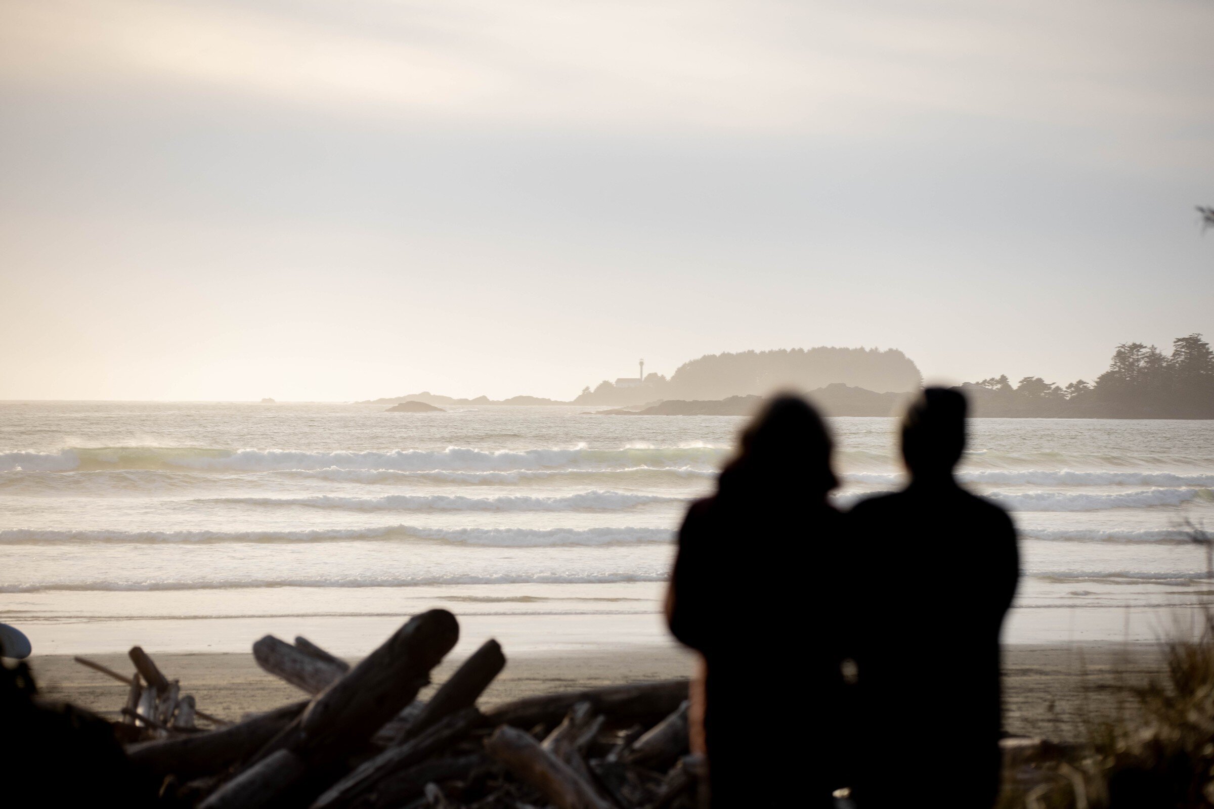 Silhouette of couple overlooking Cox Bay