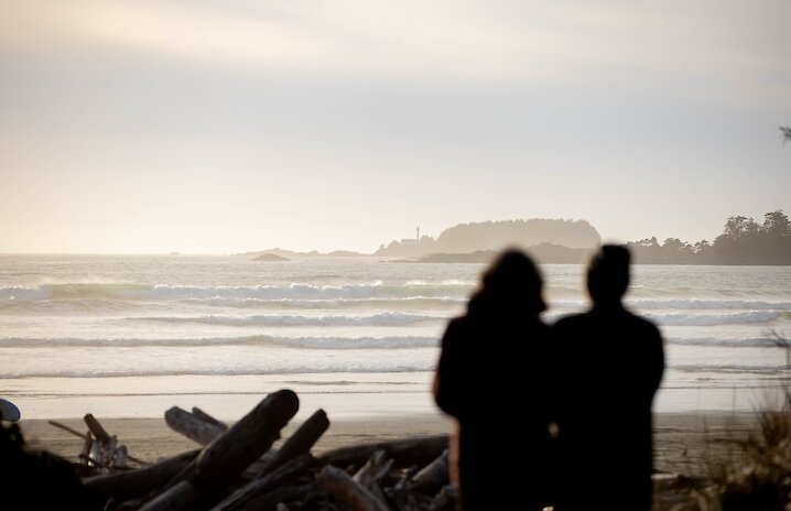 Silhouette of couple overlooking Cox Bay