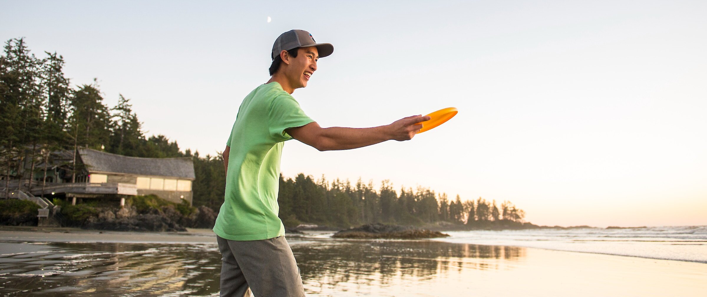 Person throwing a frisbee on Wickaninnish Beach.