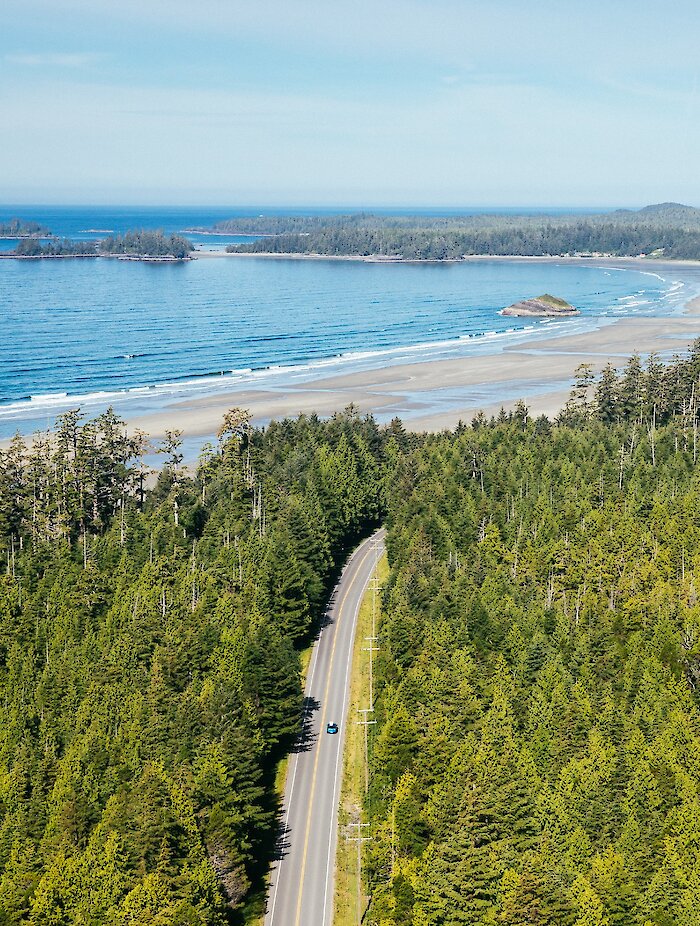 Winding highway in the forest leading to the beach and ocean