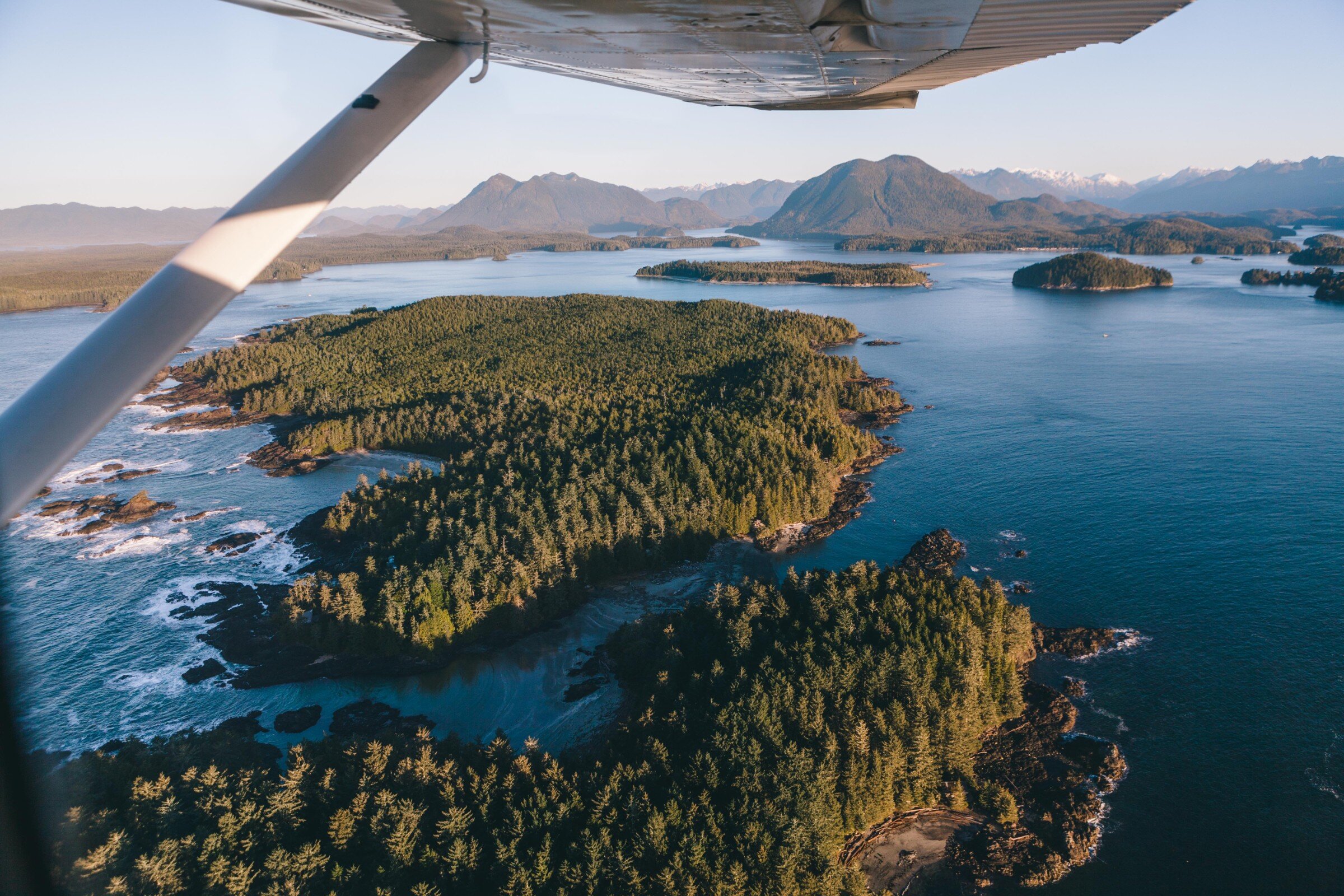 View from a floatplane looking at islands and ocean below