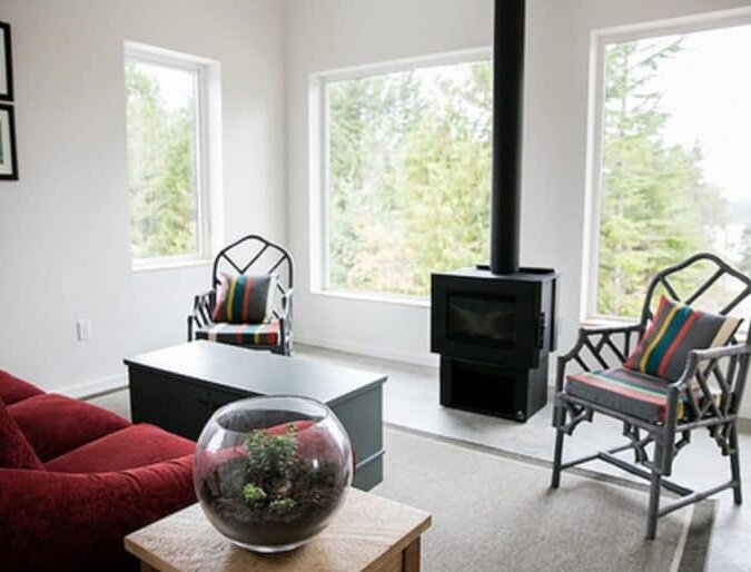 Living room with wood burning stove and ocean view