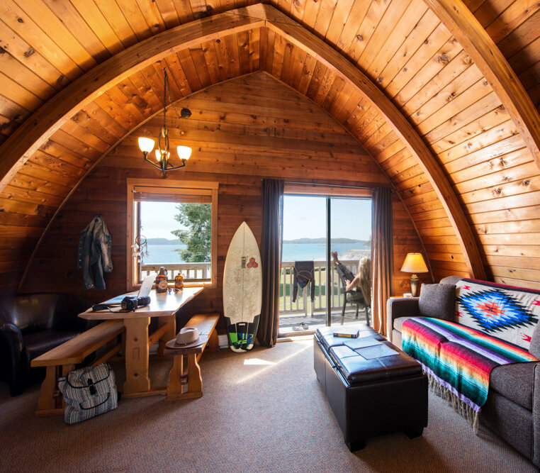 Interior of a wooden A-frame cabin