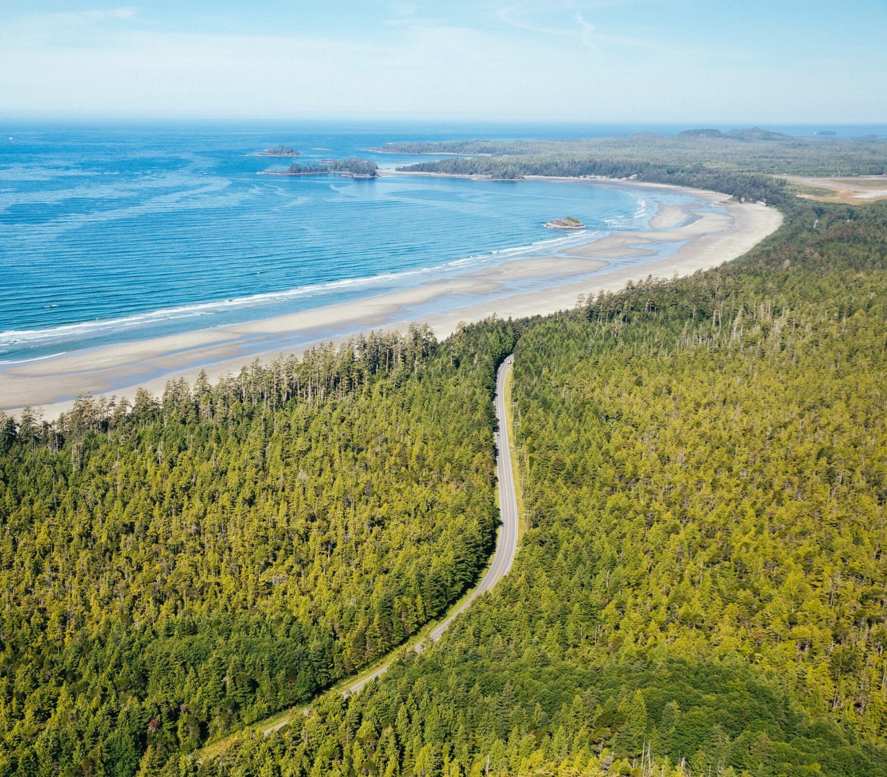 Highway winding through the forest to the beach and towards town