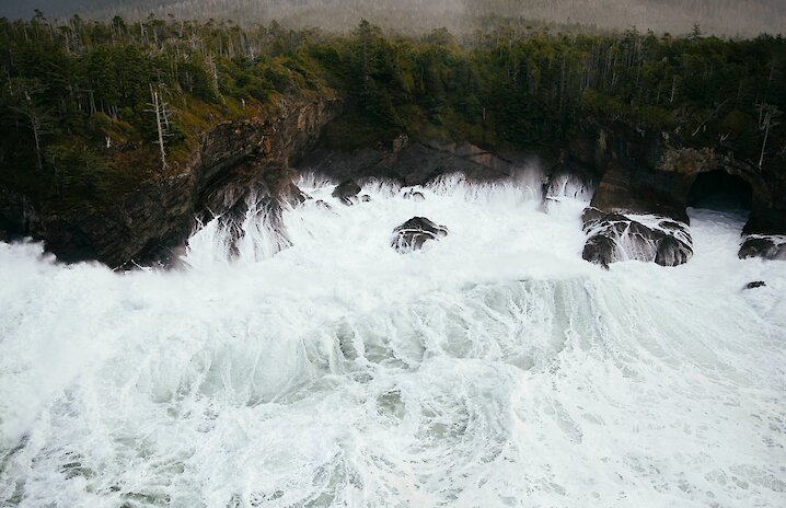 Stormy view of the ocean with large waves against the windswept coast