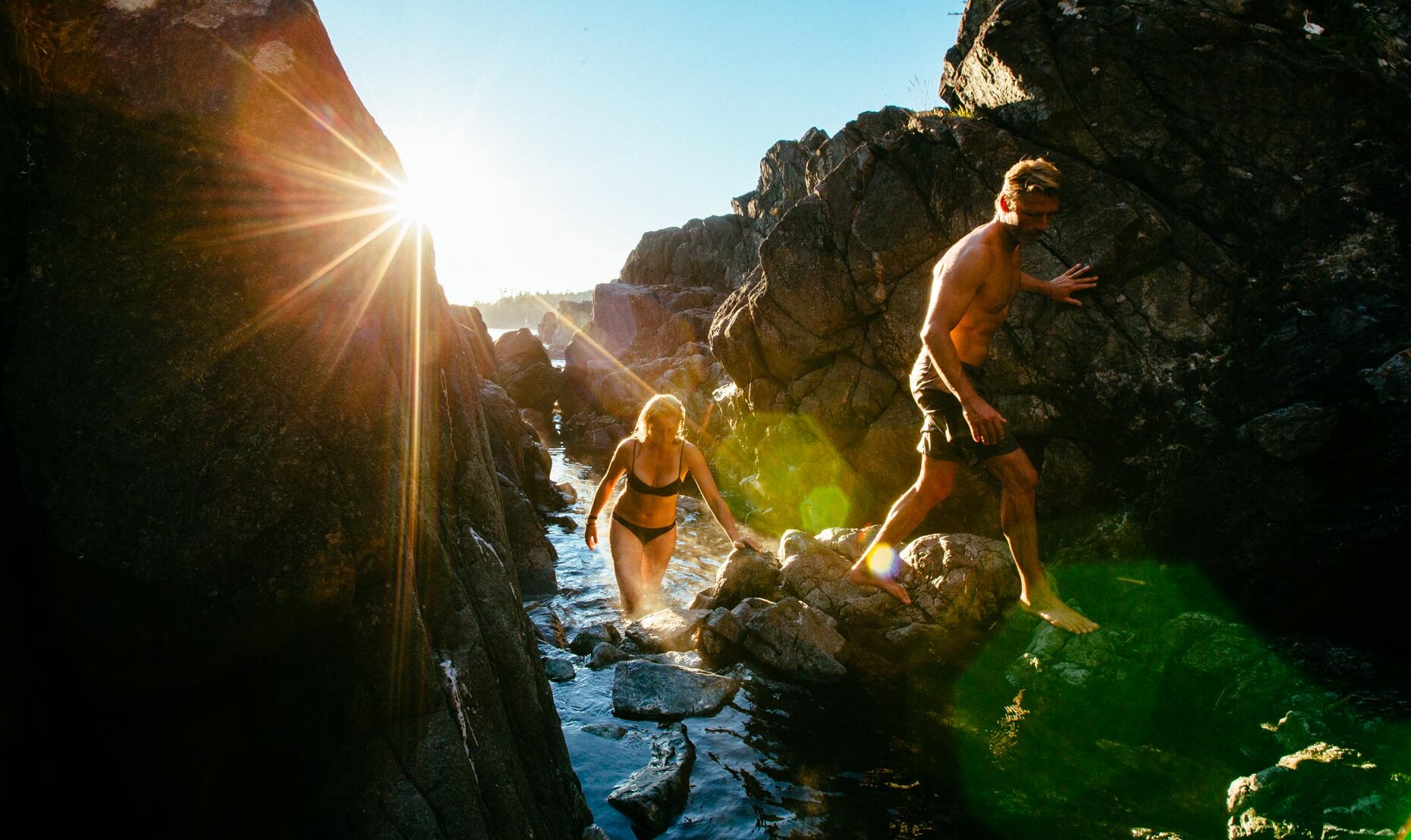 People climbing out of the hot springs rock pools