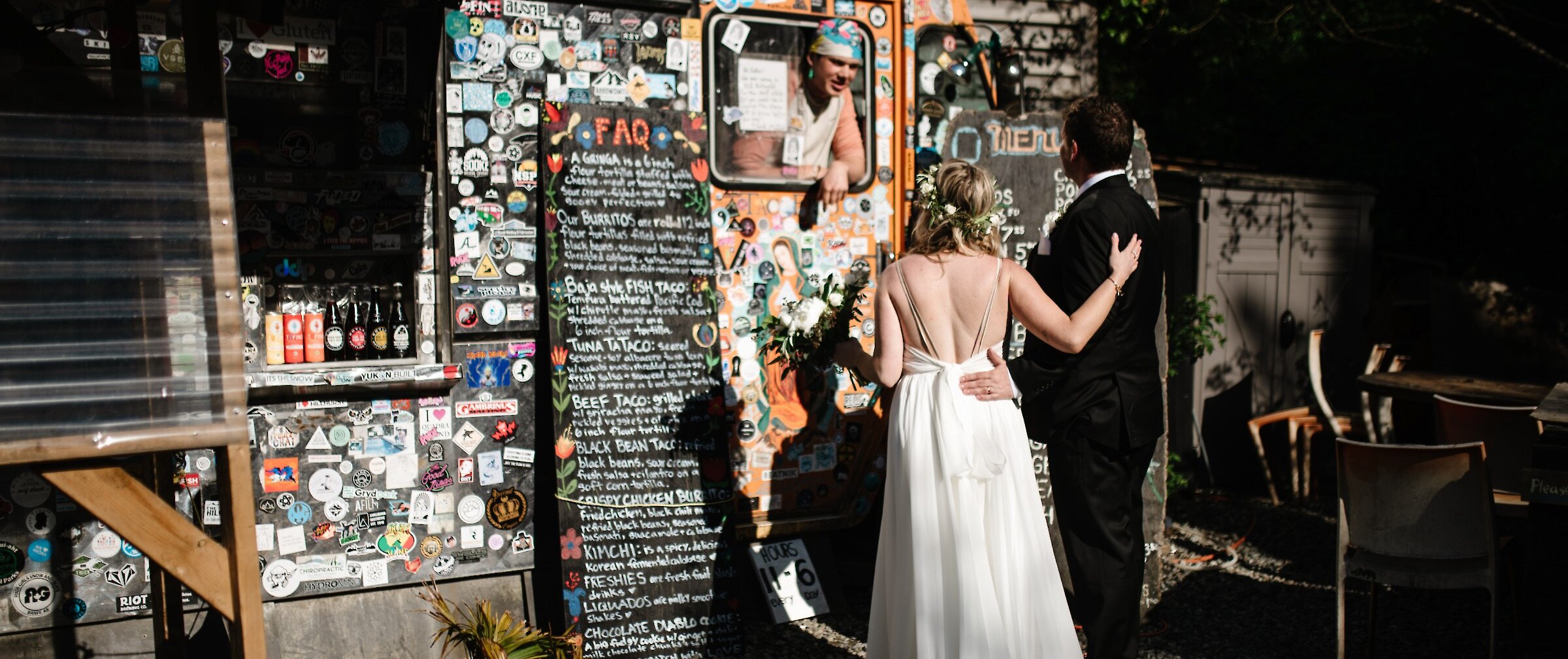 Married couple ordering tacos from a food truck