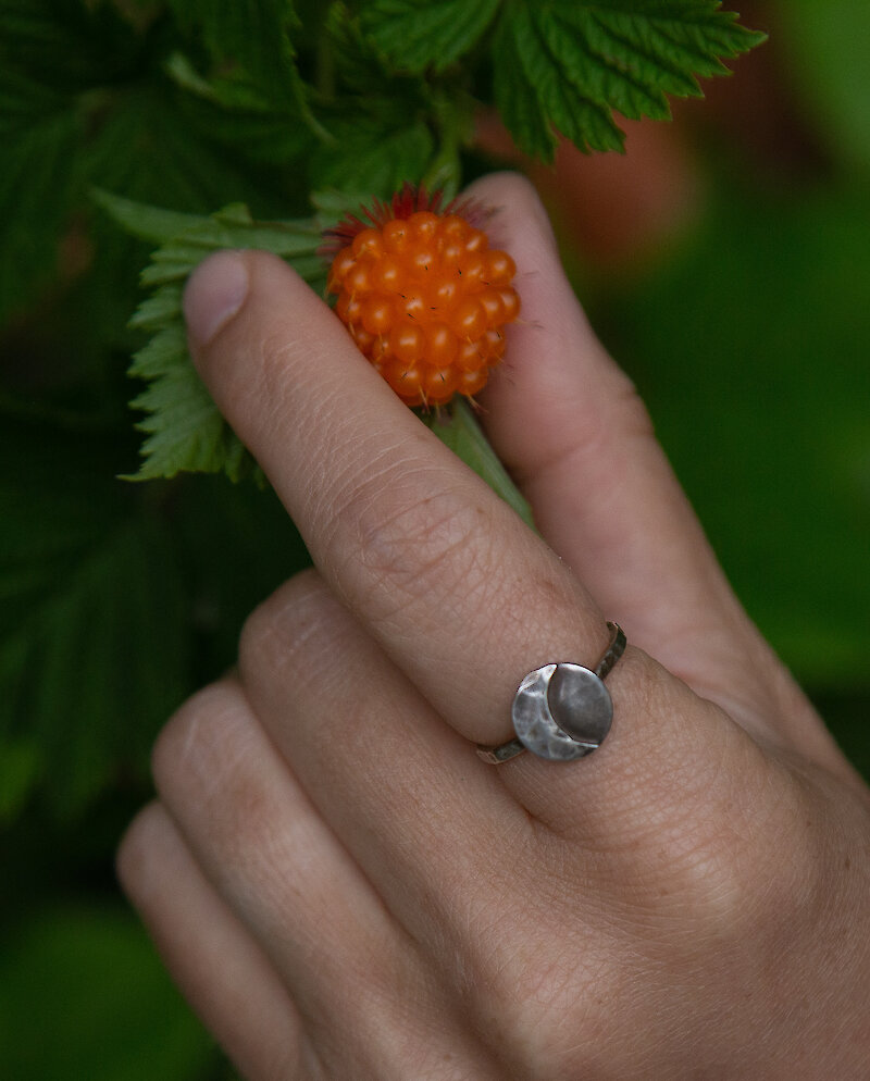 Handmade metal ring on a hand