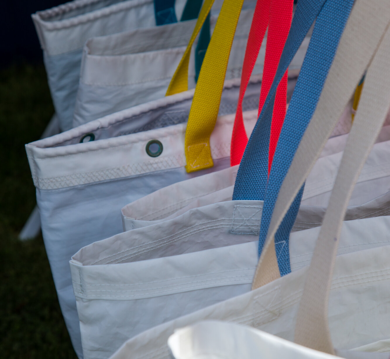 Reusable gift bags hanging in a line