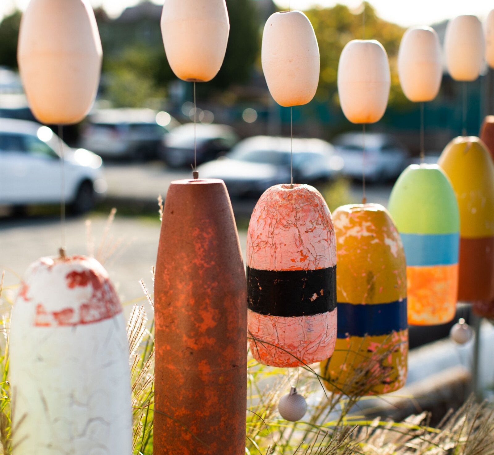 Multicoloured fishing buoys hanging from a line